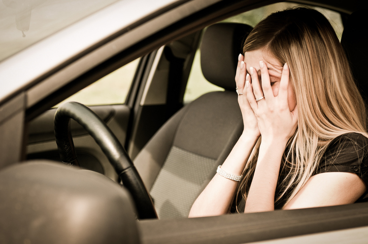 In troubles – unhappy woman in car